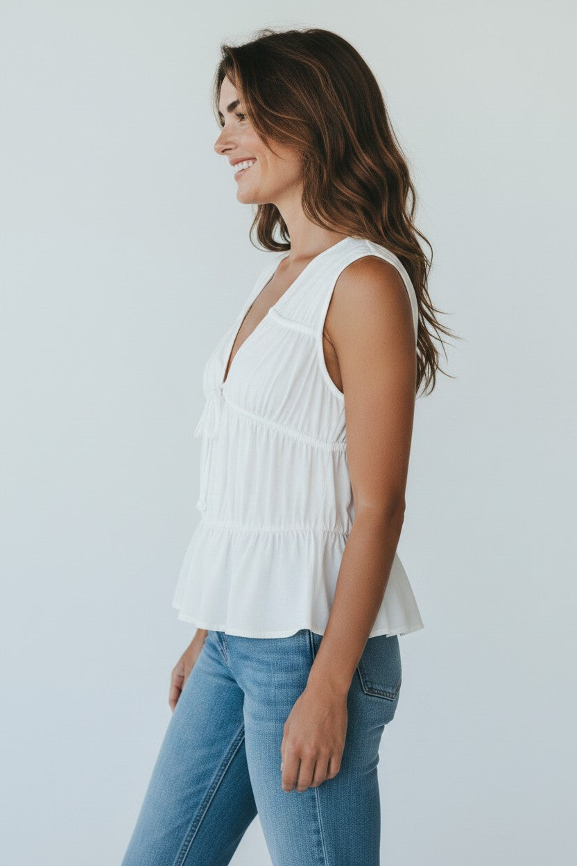 Capri by Sunset & Co. white sleeveless v-neck top with tie closure and ruffle hem. Lightweight and breezy.